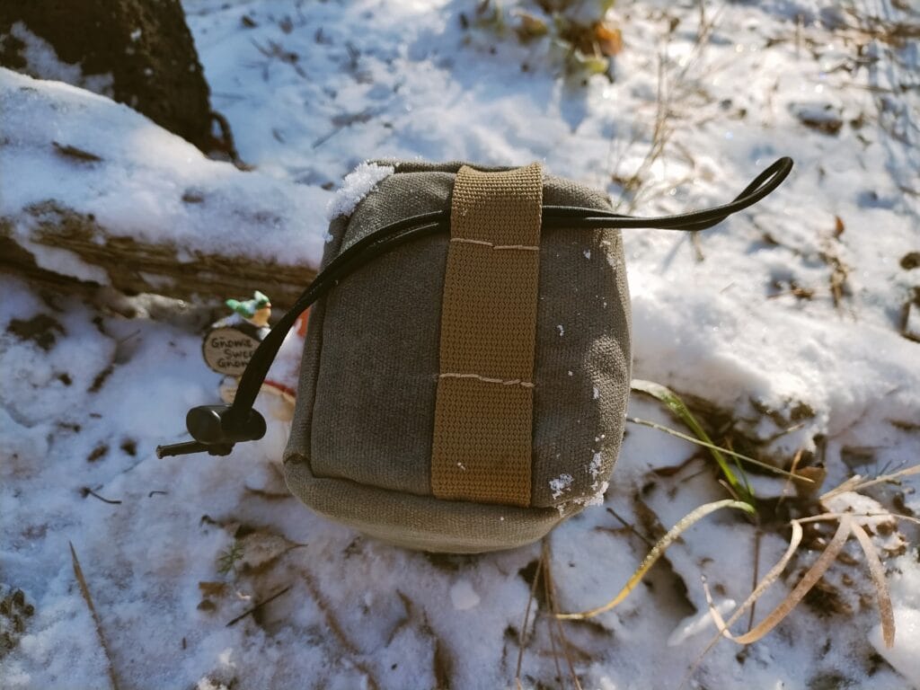 Bottom view of a DIY bike stem bag in a garden.