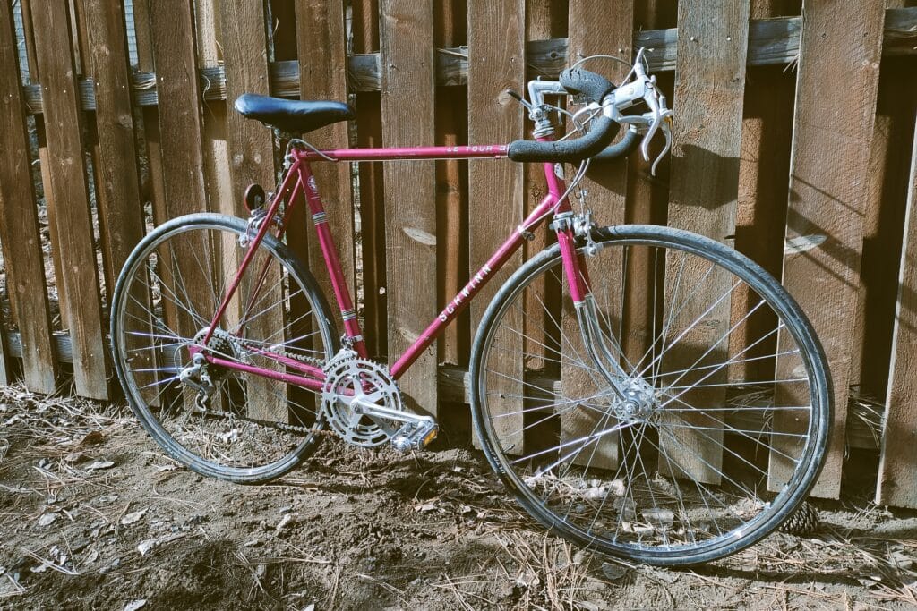 Front profile view of a violet-colored 1977 Schwinn Le Tour II.