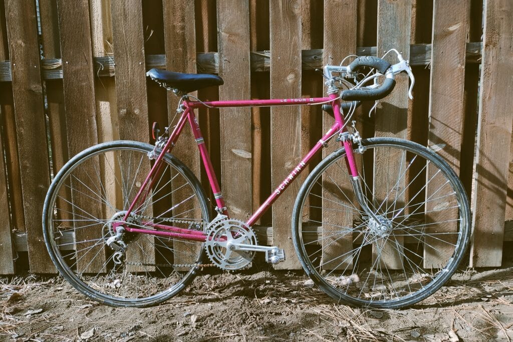 Profile view of a violet-colored 1977 Schwinn Le Tour II.