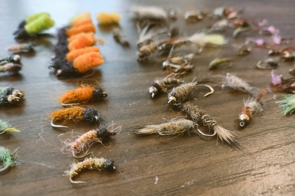 An assortment of large, colorful fly fishing flies.