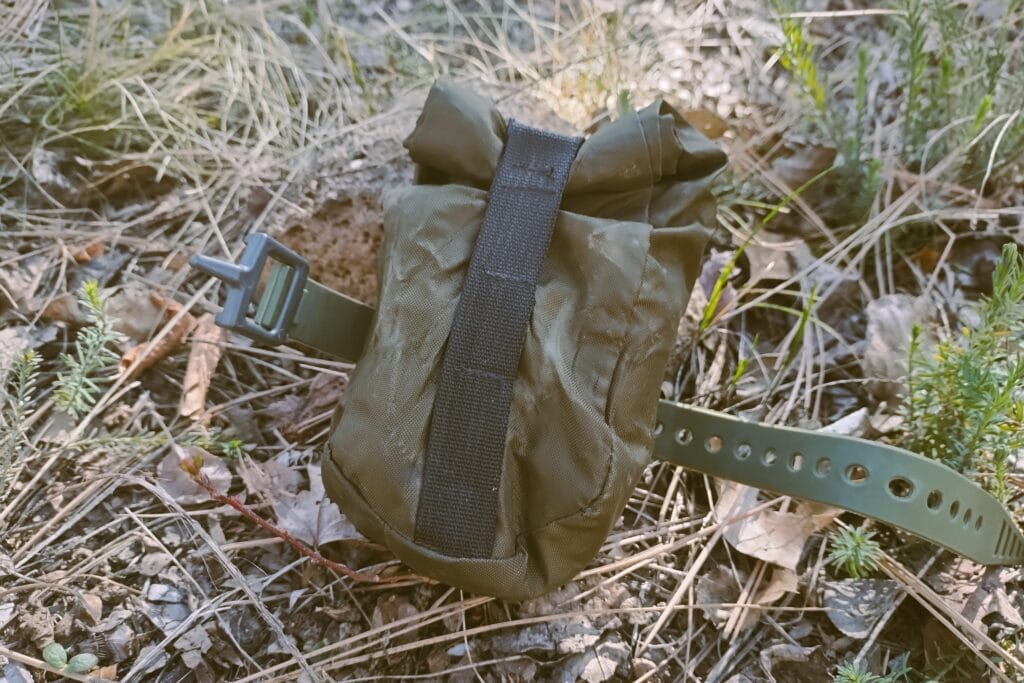 DIY roll top saddle bag in a natural garden.